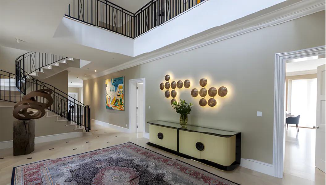 Luxury home interior with carpet and winding staircase